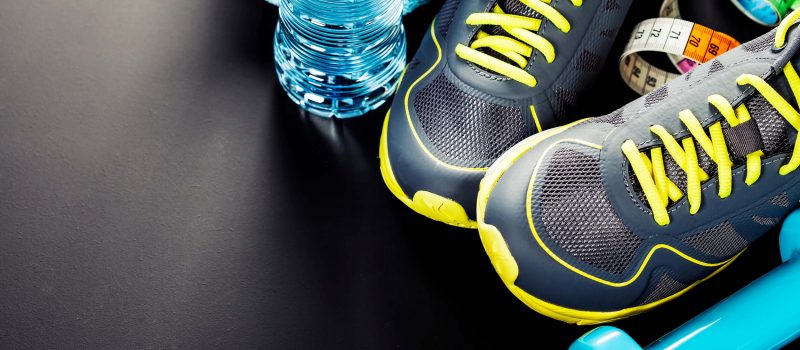 Fitness gear with sneakers and water bottle.