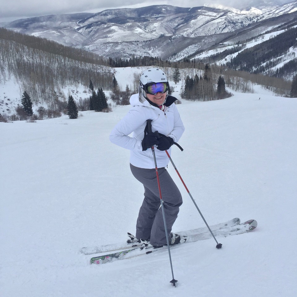 Person skiing on snowy mountain slope.