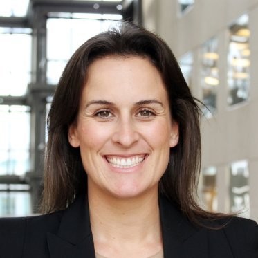 Smiling woman in a professional setting.