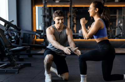 Man and woman exercising in gym